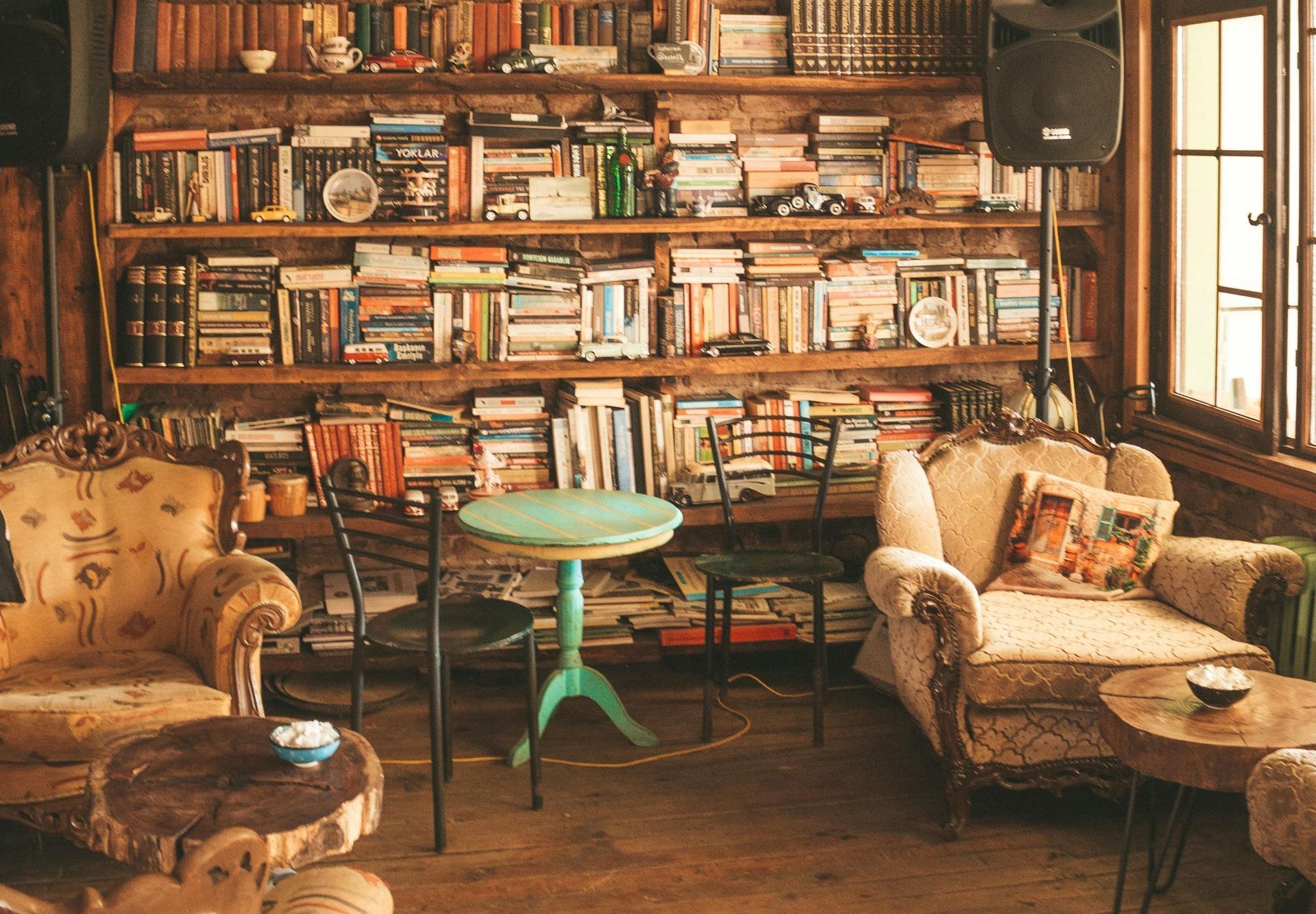 Bookshelves filled with books in a cozy library room